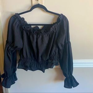 Black fancy top with ruffles/kind of cropped